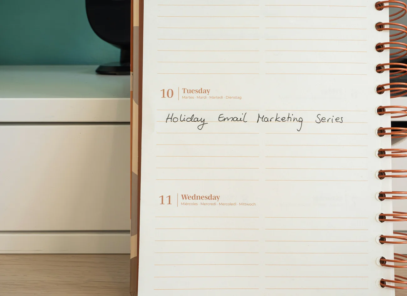 a notepad with the words holiday email marketing series written on it